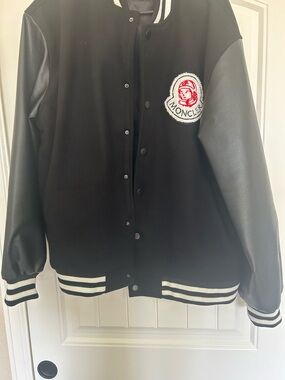 Moncler Black Jacket with Red and White Logo Patch